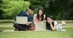 People gathered around a computer 